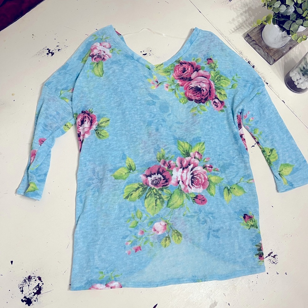 Blue floral open back sweater with knot detail